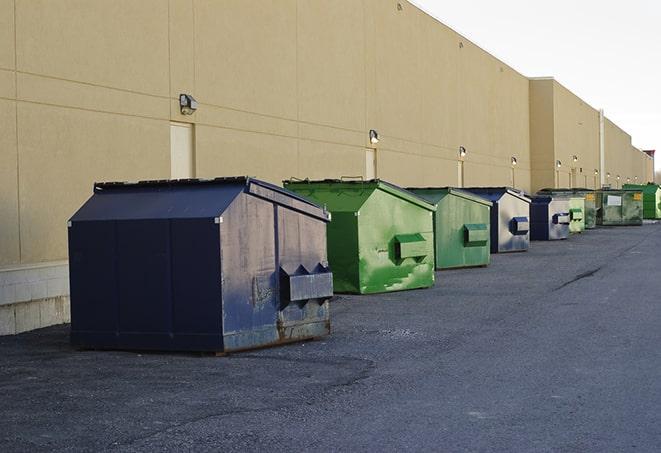 construction dumpsters stacked in a row on a job site in Alpine